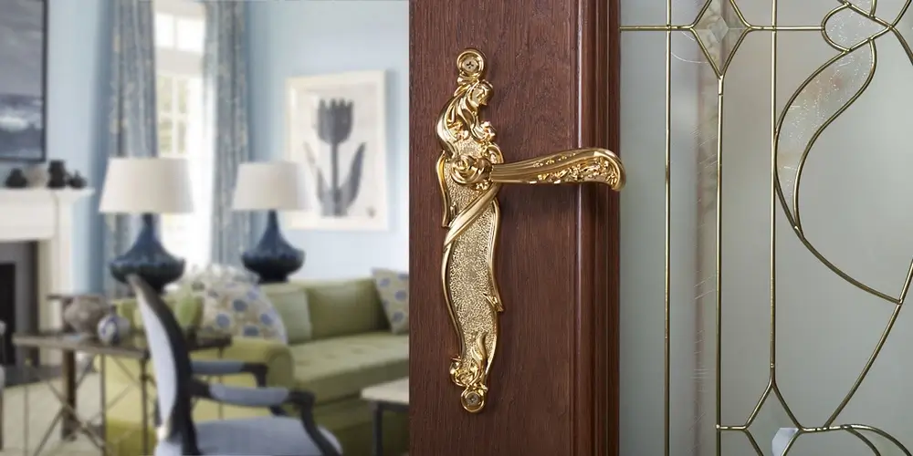 A geometric, polished gold handle reflecting Art Deco style.