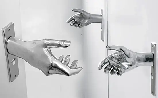 Close-up of a hand polishing a metal object.