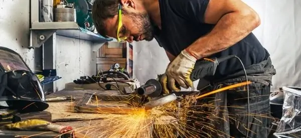 A person carefully hand-polishing a finished metal product.